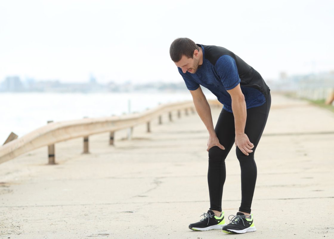 Exhausted runner resting after sport